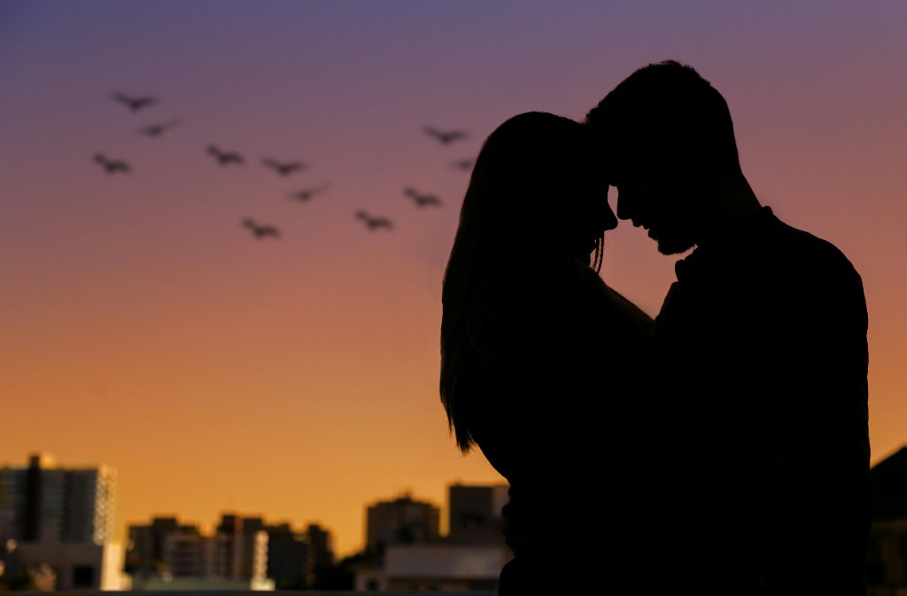 Couple silhouettes at sunset — connection and support